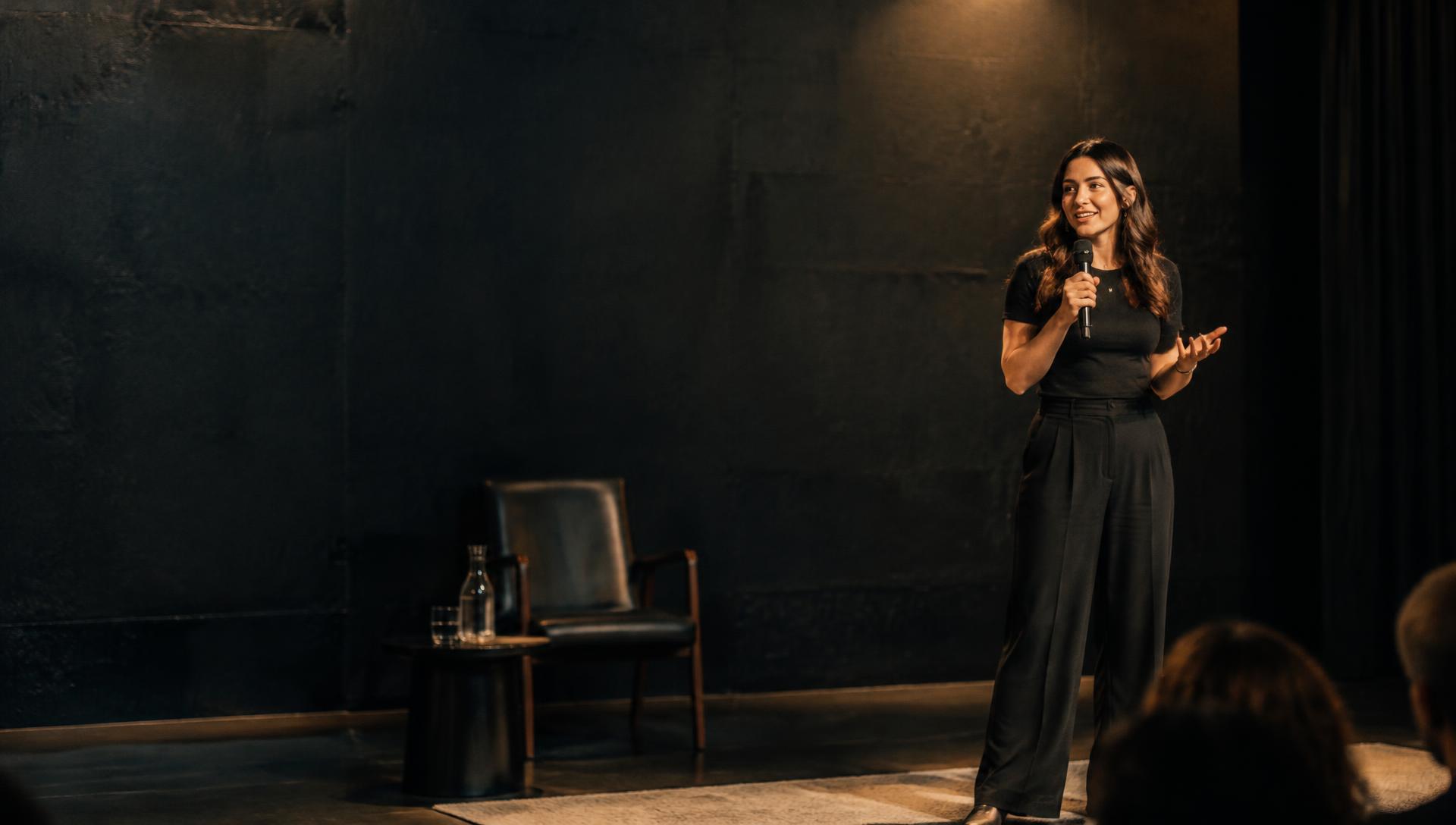 Illustrative image of a founder speaking on an intimate live stage